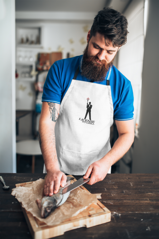 apron mockup featuring a man slicing a fish 34703 r el2