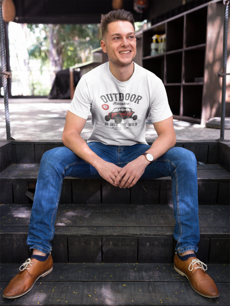 happy guy wearing a tshirt template while sitting on steps outdoors a17850