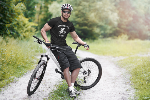 t shirt mockup of a man riding his mountain bike 38256 r el2